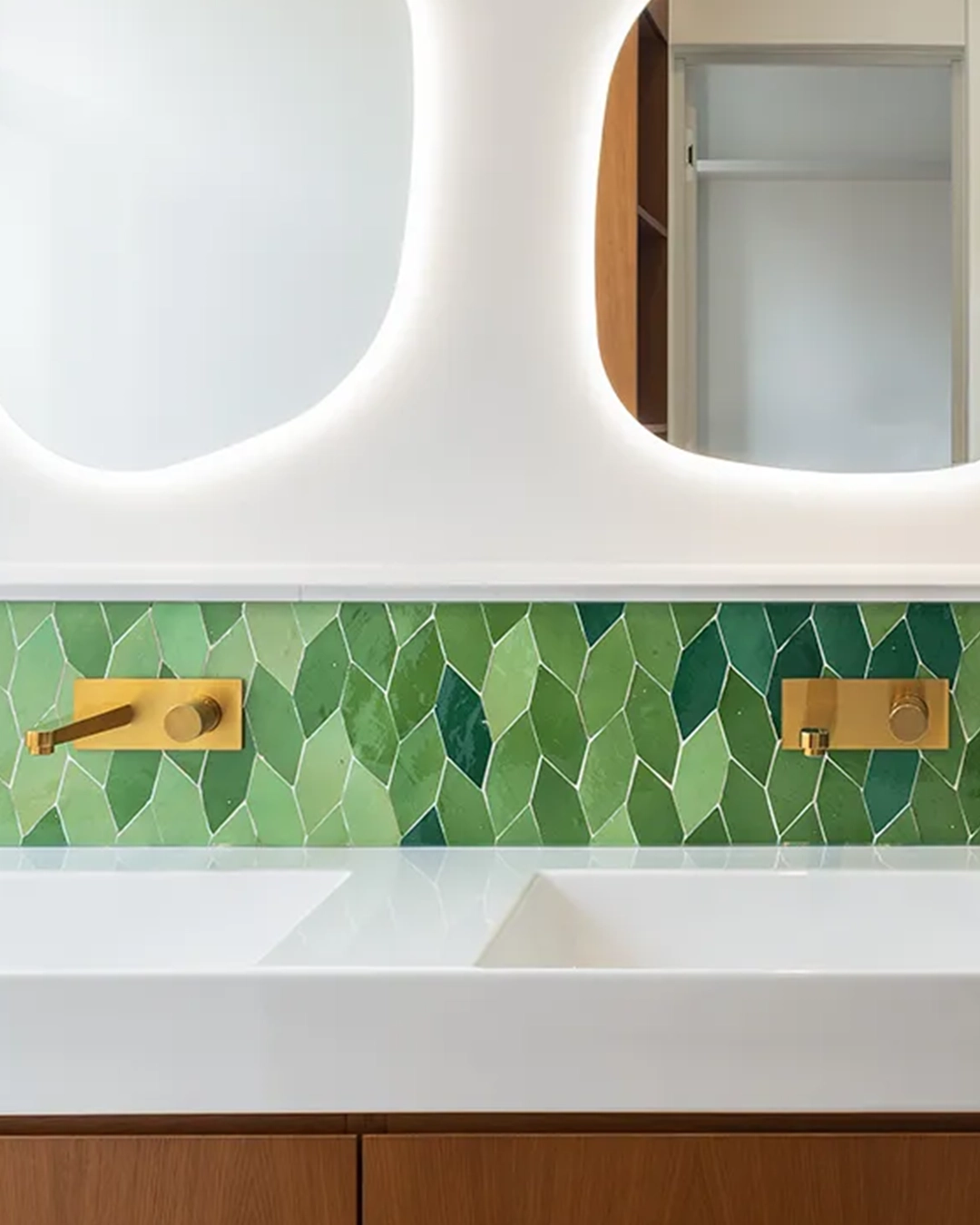 Bathroom wall tiles with a green and white leaf pattern